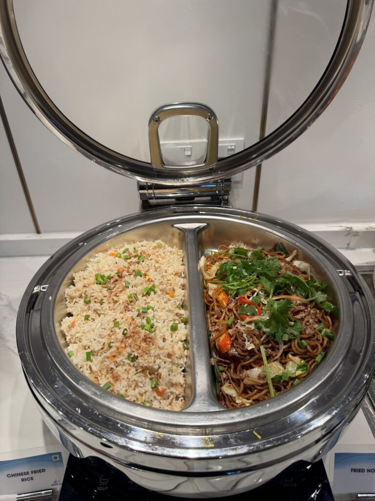 Fried rice and noodles in buffet chafing dish