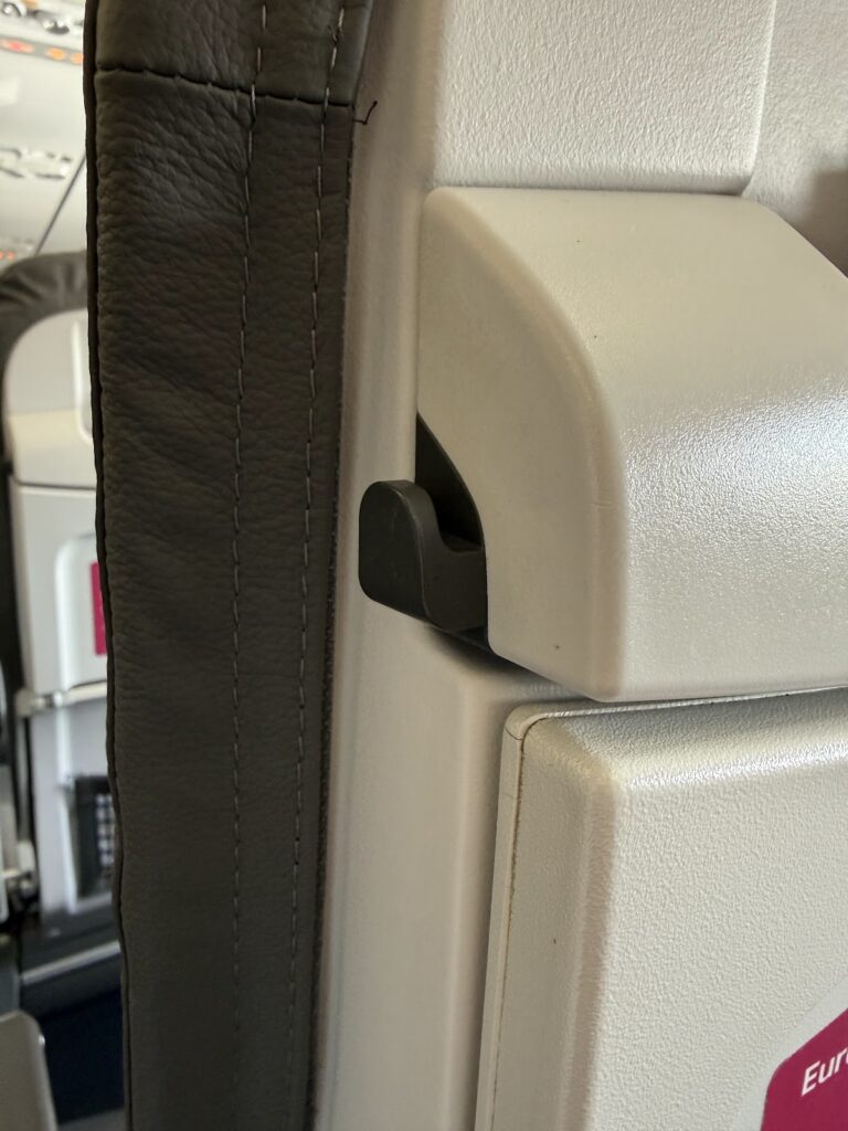 Tray table latch on Eurowings A319 seat back