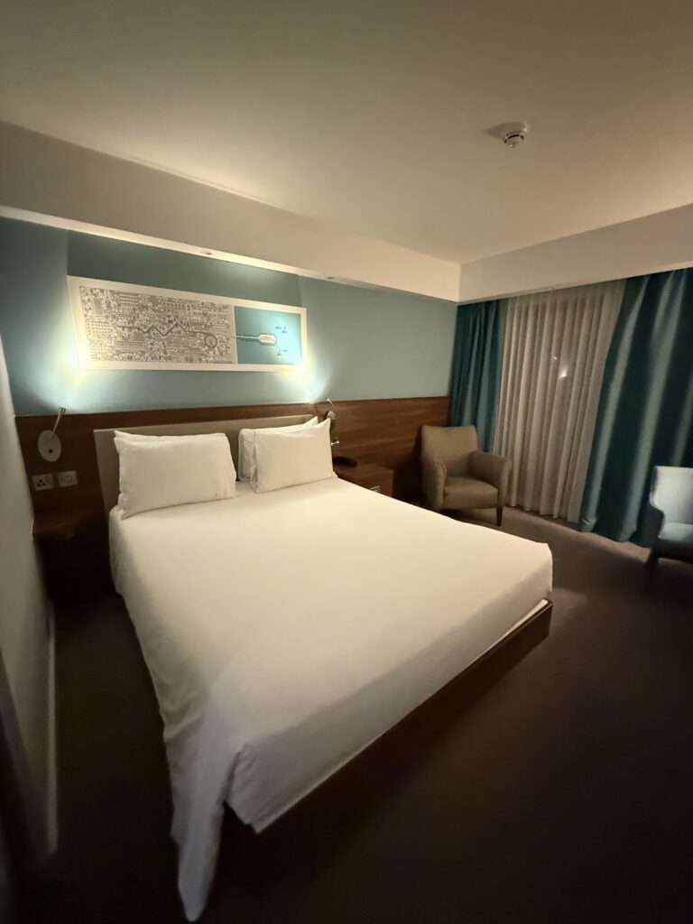 Hampton by Hilton Bournemouth king bed and armchair
