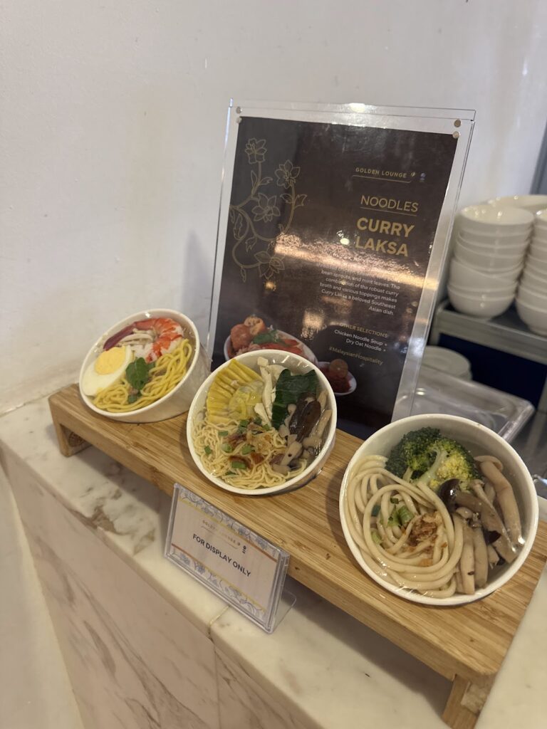 Curry laksa noodle display at Malaysia Airlines Golden Lounge