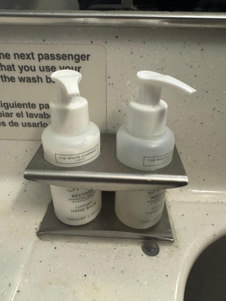 White Company toiletries in aircraft lavatory