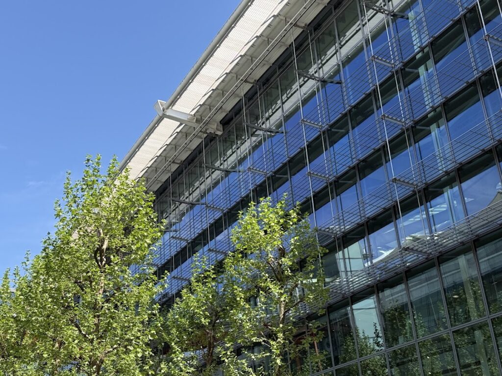 Glass exterior of Heathrow terminal under blue sky