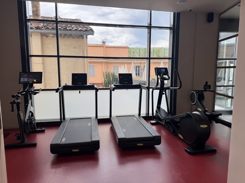 Hotel gym with treadmills and exercise bikes