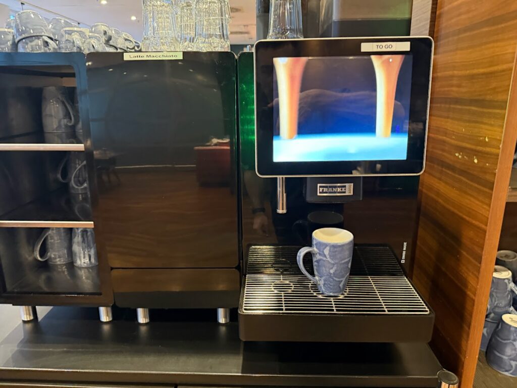 Coffee machine dispensing a drink at Hilton Cologne