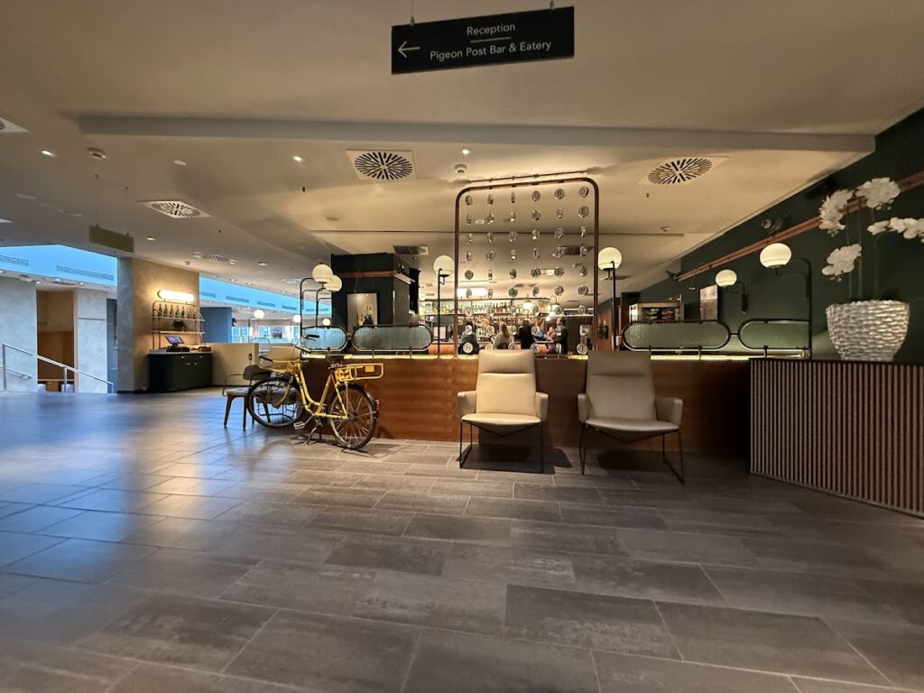 Hilton Cologne lobby with reception and bar seating