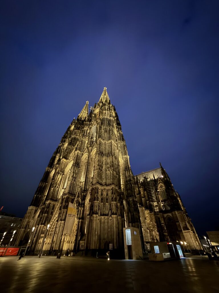 Cologne Cathedral illuminated at night near Hilton Cologne
