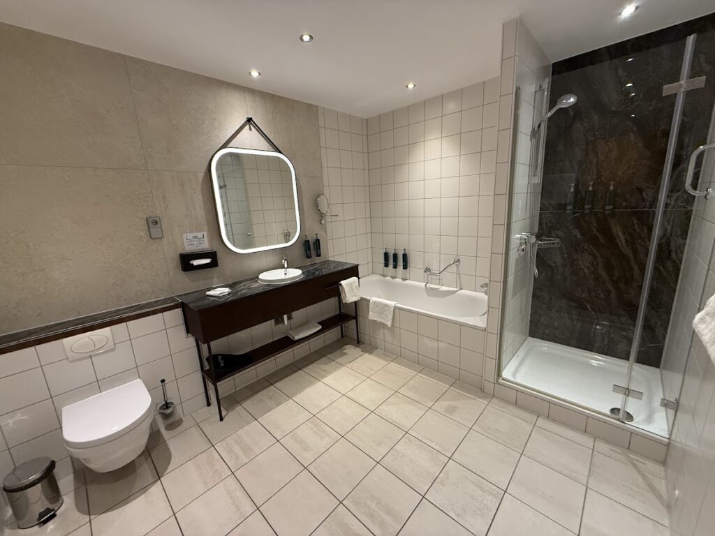 Bathroom with bathtub, separate shower, toilet, and vanity