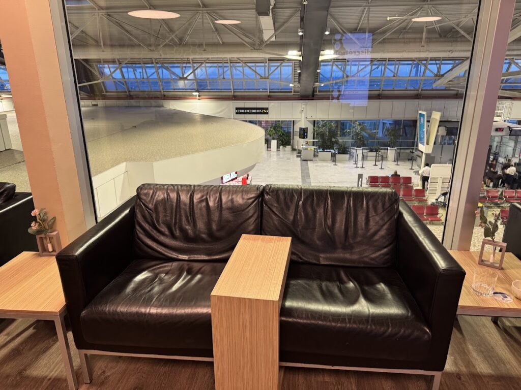 Black leather sofa overlooking Nice Airport terminal