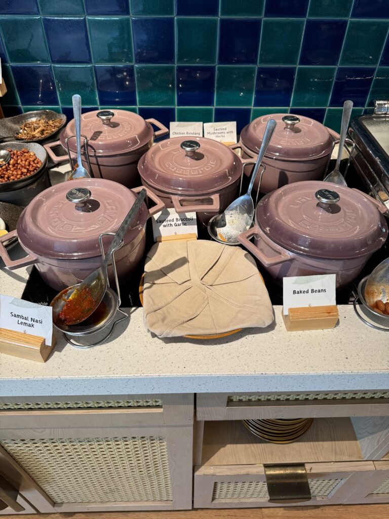 Breakfast buffet pots with sambal and rendang