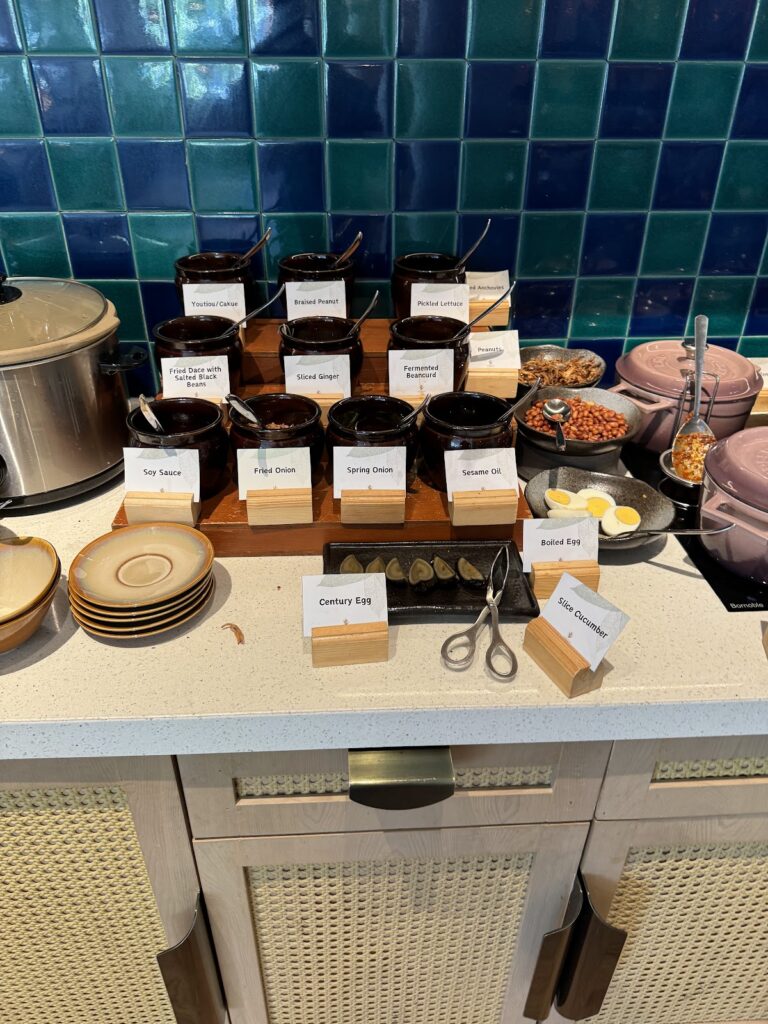 Breakfast condiments and sauces on tiled buffet counter