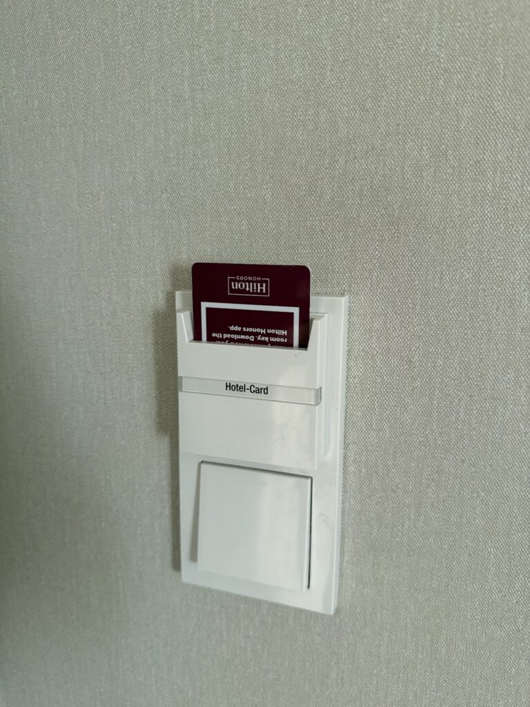 Hilton key card inserted in room power slot