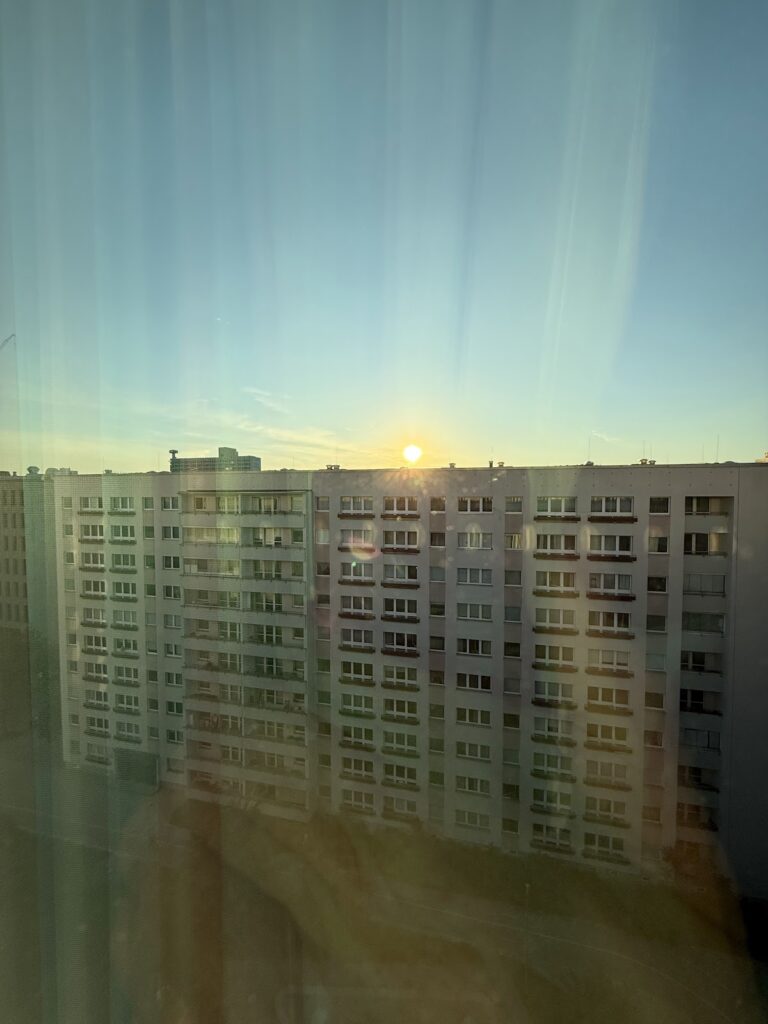 Sunrise view over apartment blocks from hotel window