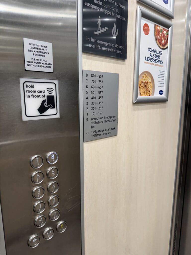 Elevator buttons and floor guide inside the hotel