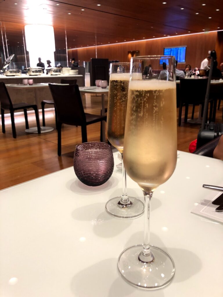 Champagne flutes on a lounge dining table