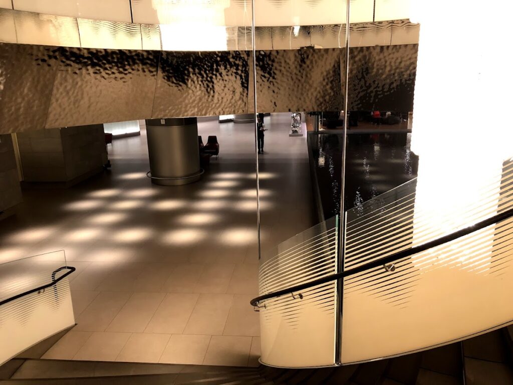 Curved staircase and glowing wall inside the lounge