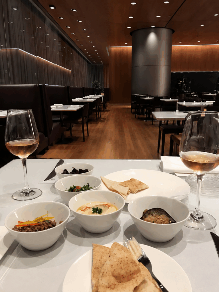 Arabic mezze and drinks on a restaurant table