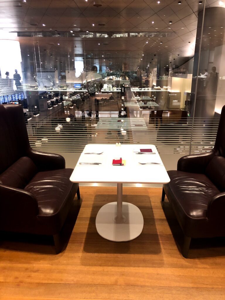 Two leather armchairs overlooking the dining area