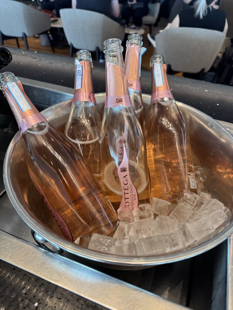 Chilled rosé sparkling wine bottles in an ice bucket