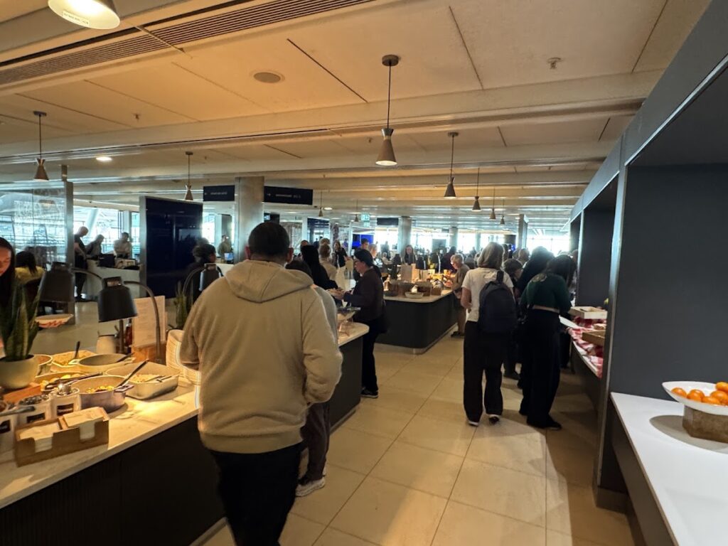 Crowded buffet area inside BA Galleries South lounge