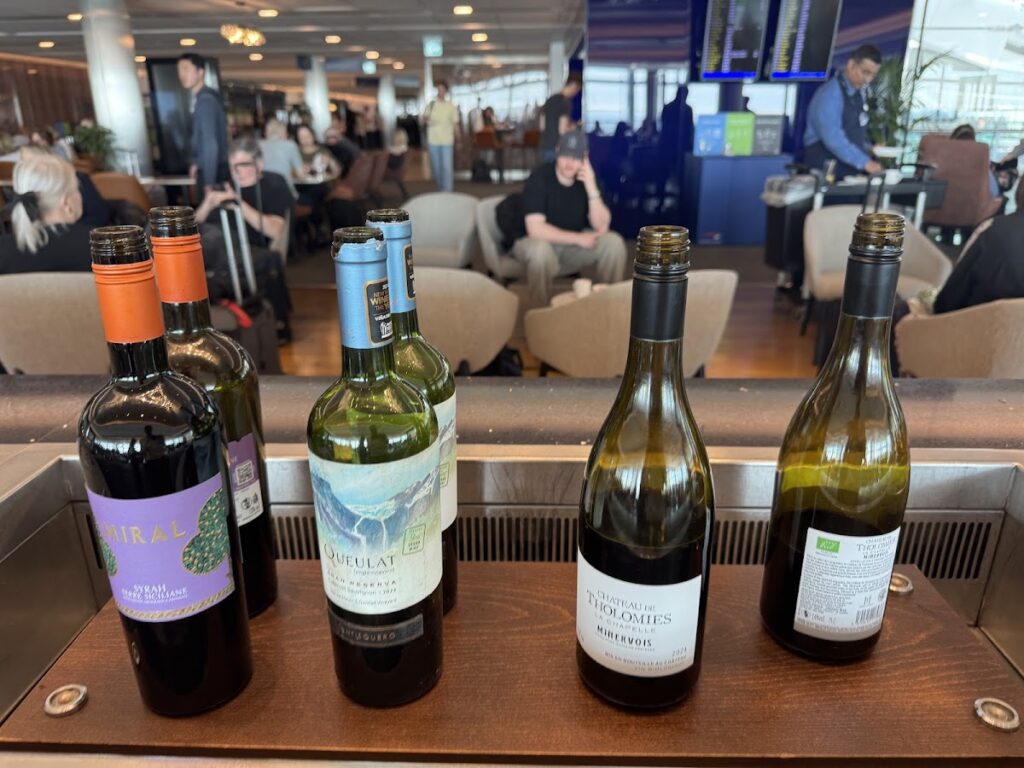 Wine bottles overlooking a crowded BA Galleries South seating area