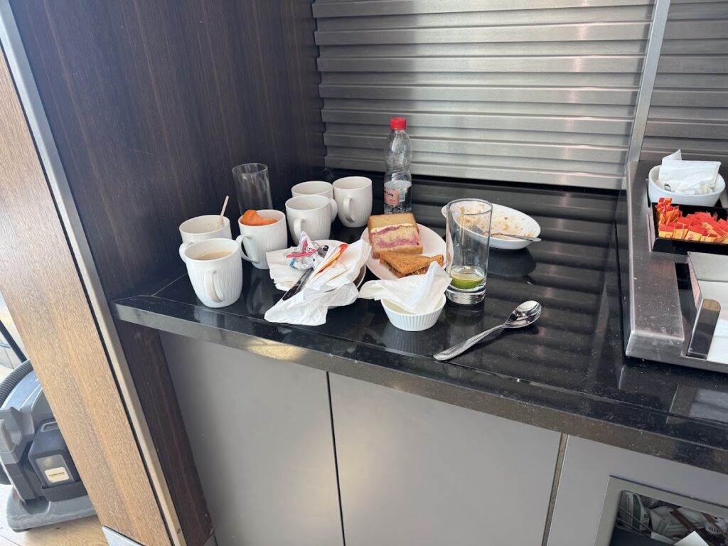 Messy counter at BA Galleries South with used cups