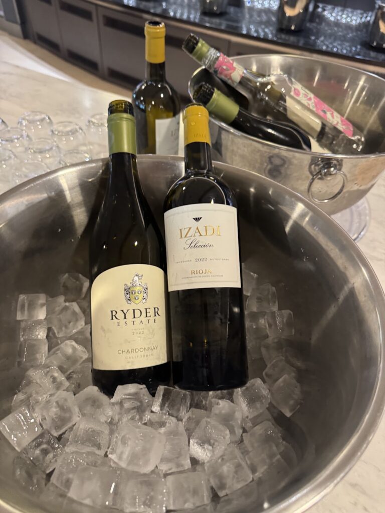 Wine bottles chilled in ice buckets at lounge bar