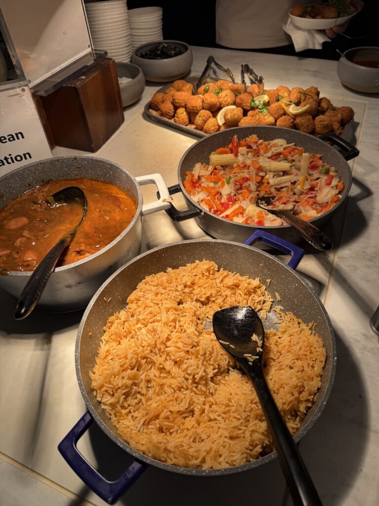 Rice, curry, vegetables, and snacks on lounge buffet