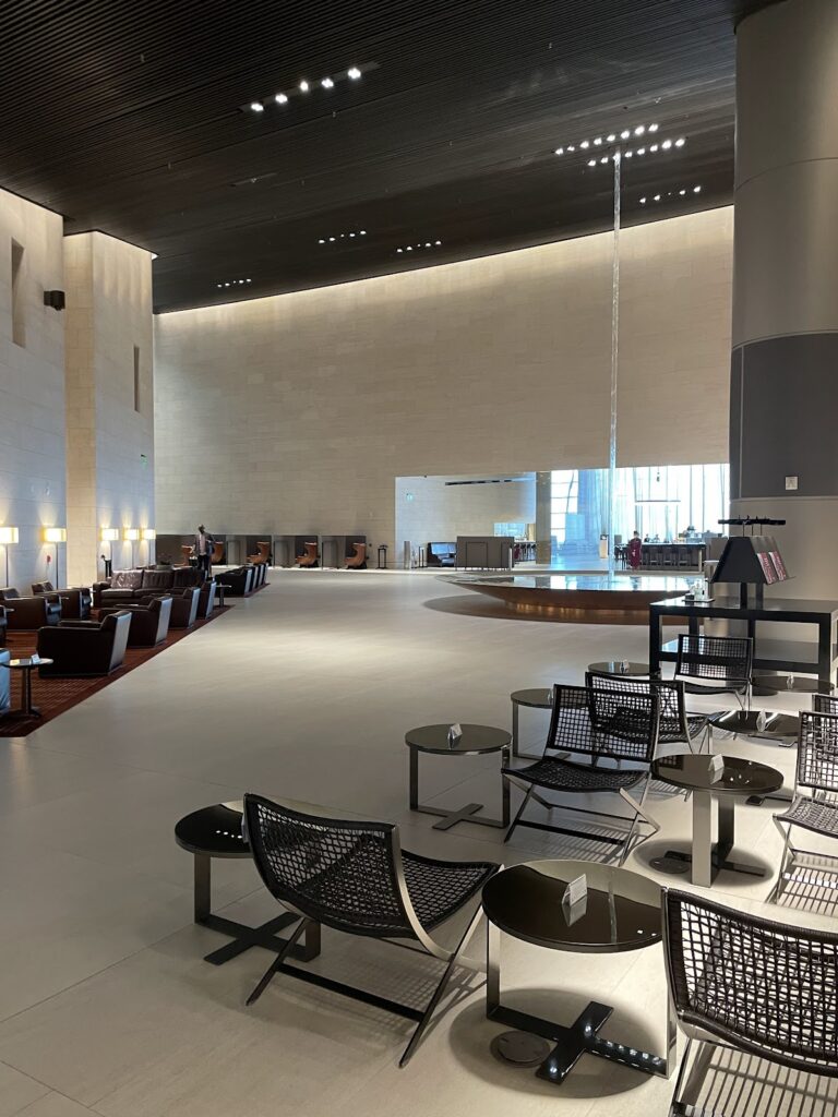 Spacious lounge seating beneath high museum-like walls