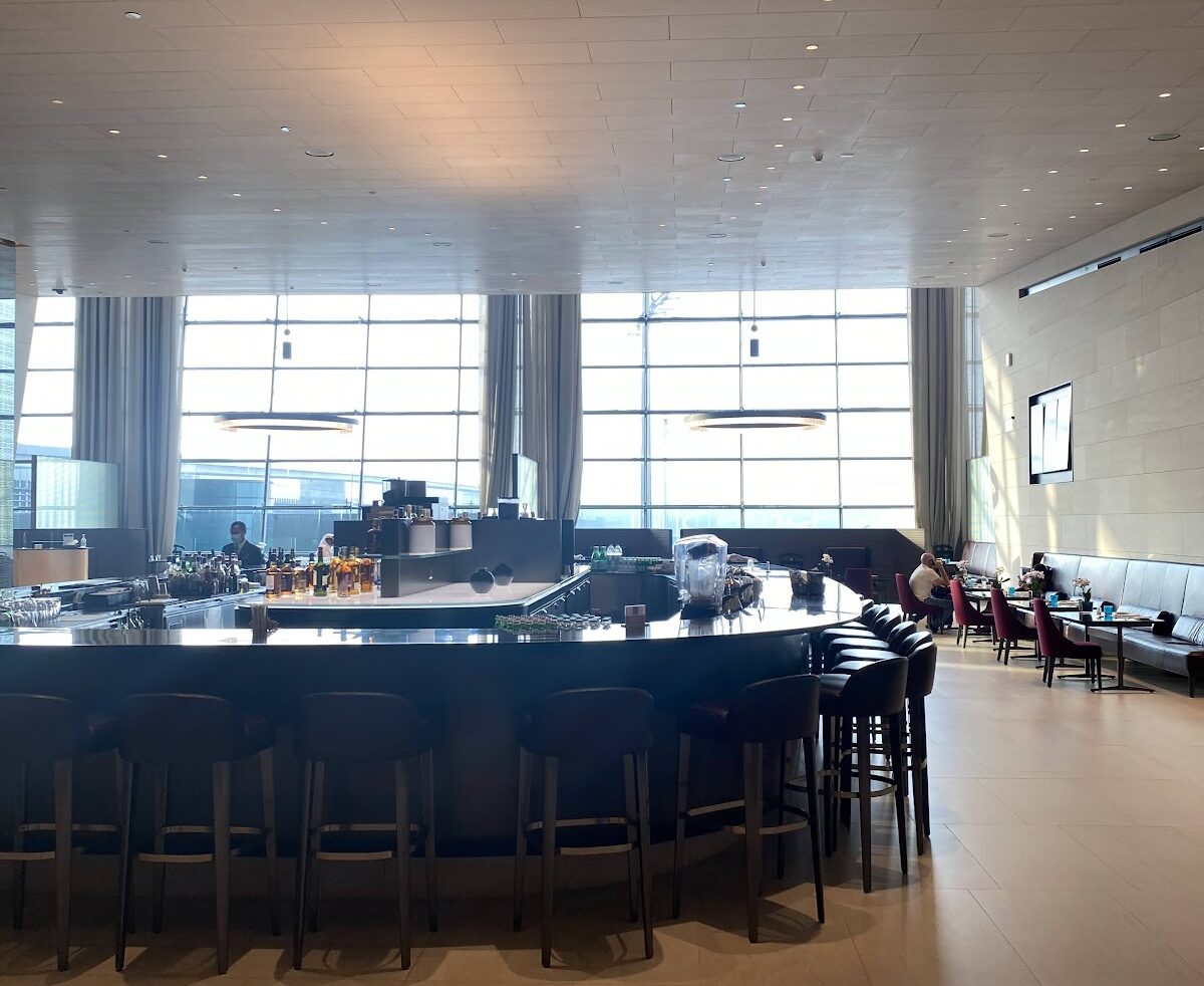 Bar seating and dining area with airport views