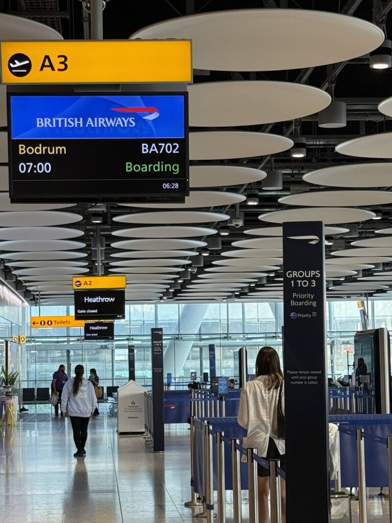 BA702 Bodrum boarding screen at Heathrow gate A3