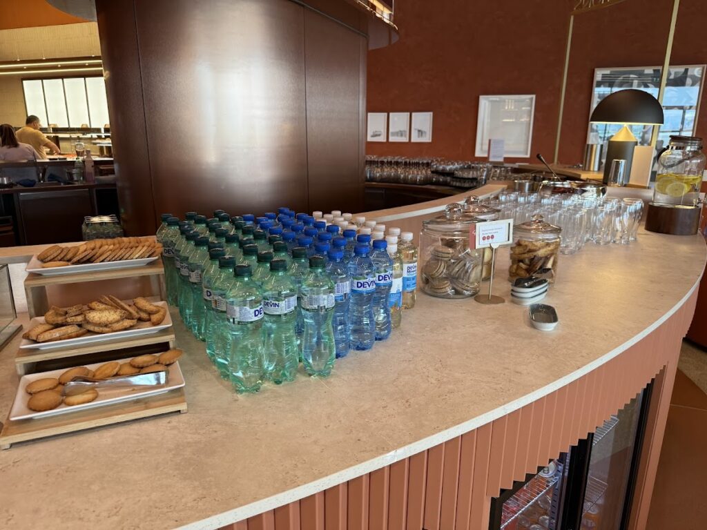 Water bottles and cookies on Primeclass Lounge buffet counter