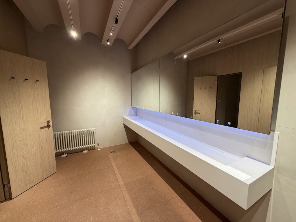 Modern lounge bathroom with long lit vanity