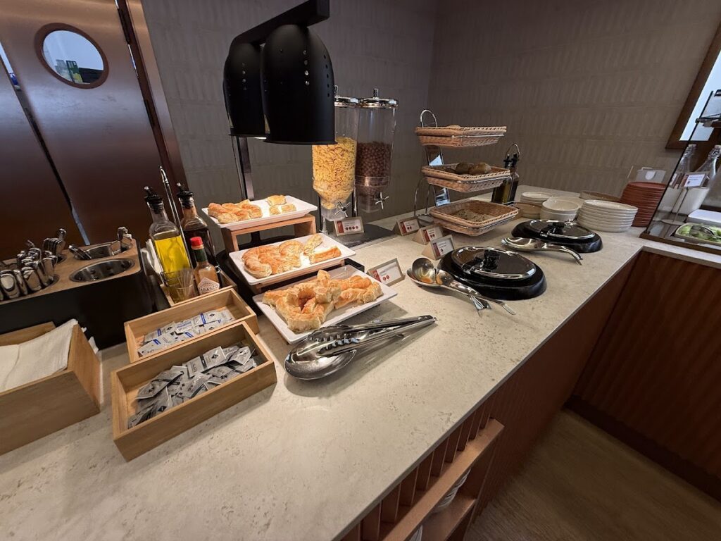 Buffet counter with pastries and cereals at the lounge