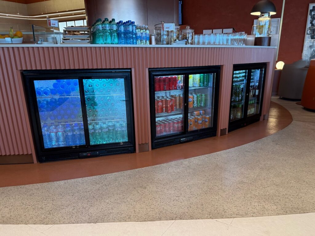 Drinks fridges stocked with soft drinks and beers