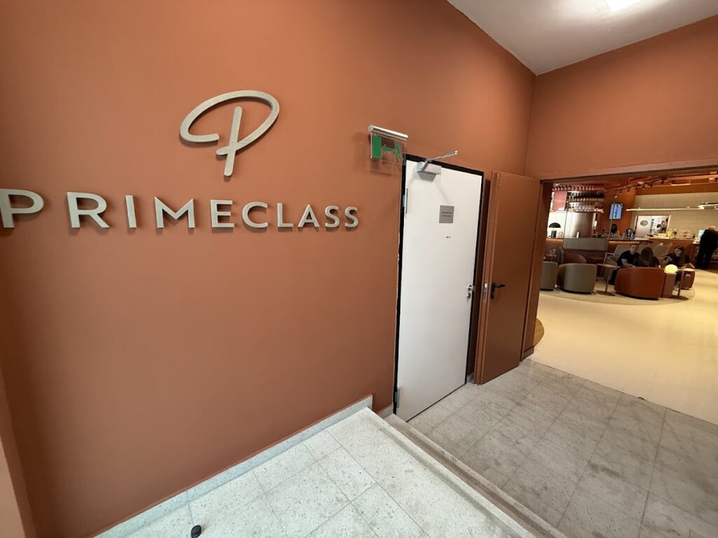 Primeclass branded signage at lounge entrance door