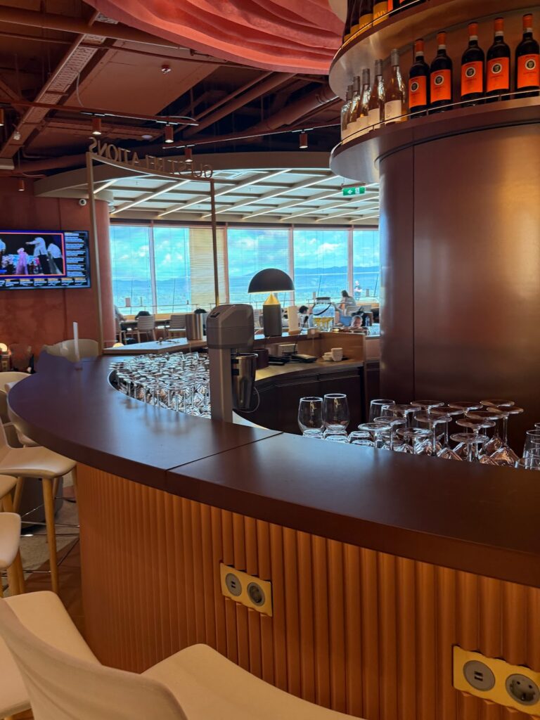 Curved bar with wine glasses at Primeclass Lounge Sofia