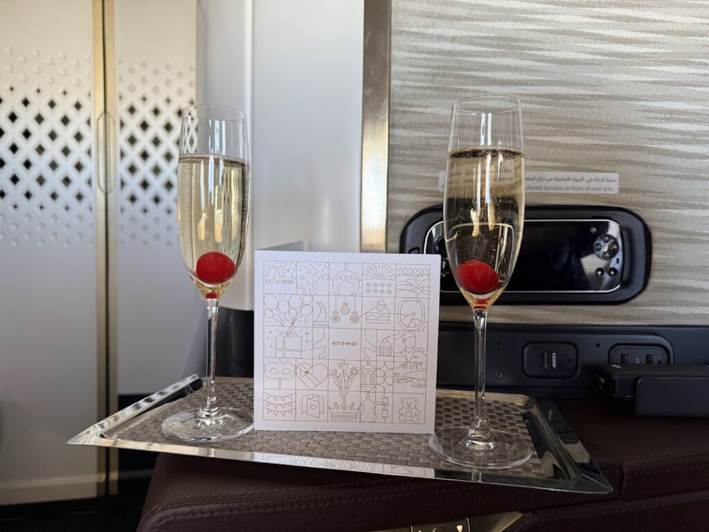 Welcome champagne flutes and card in Etihad Apartment