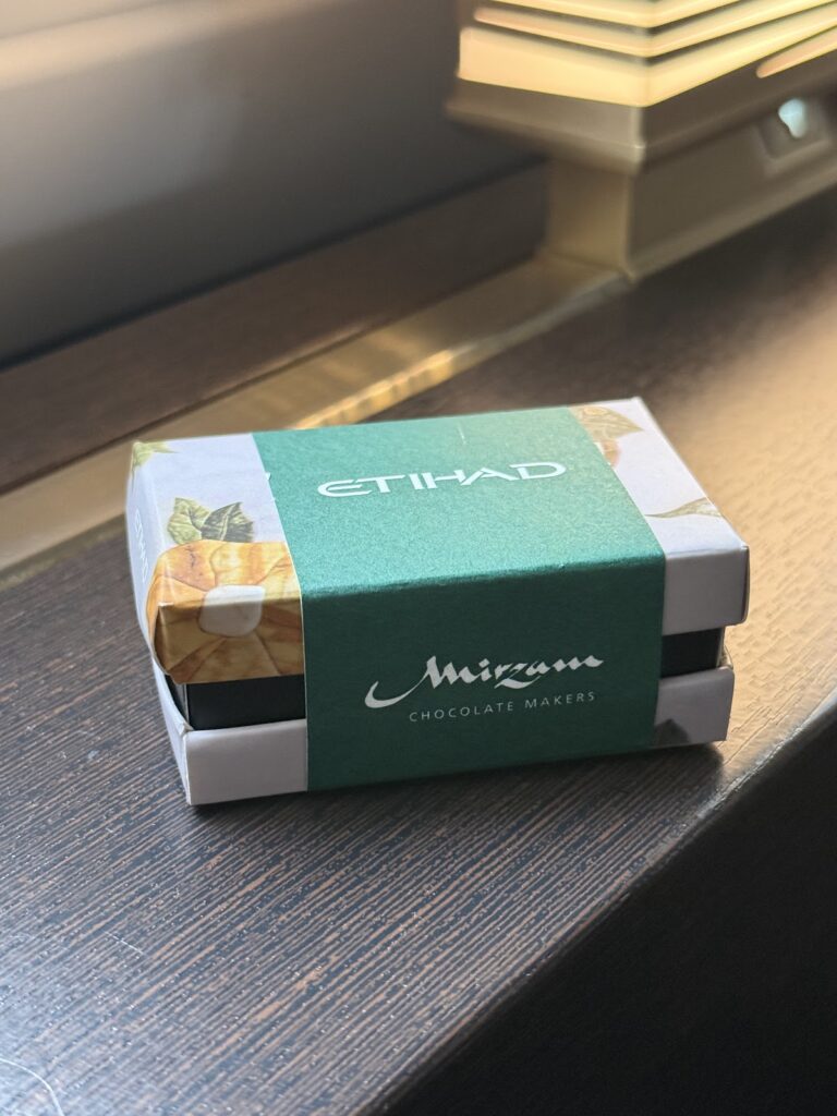 Etihad Mirzam chocolate box on Apartment side console