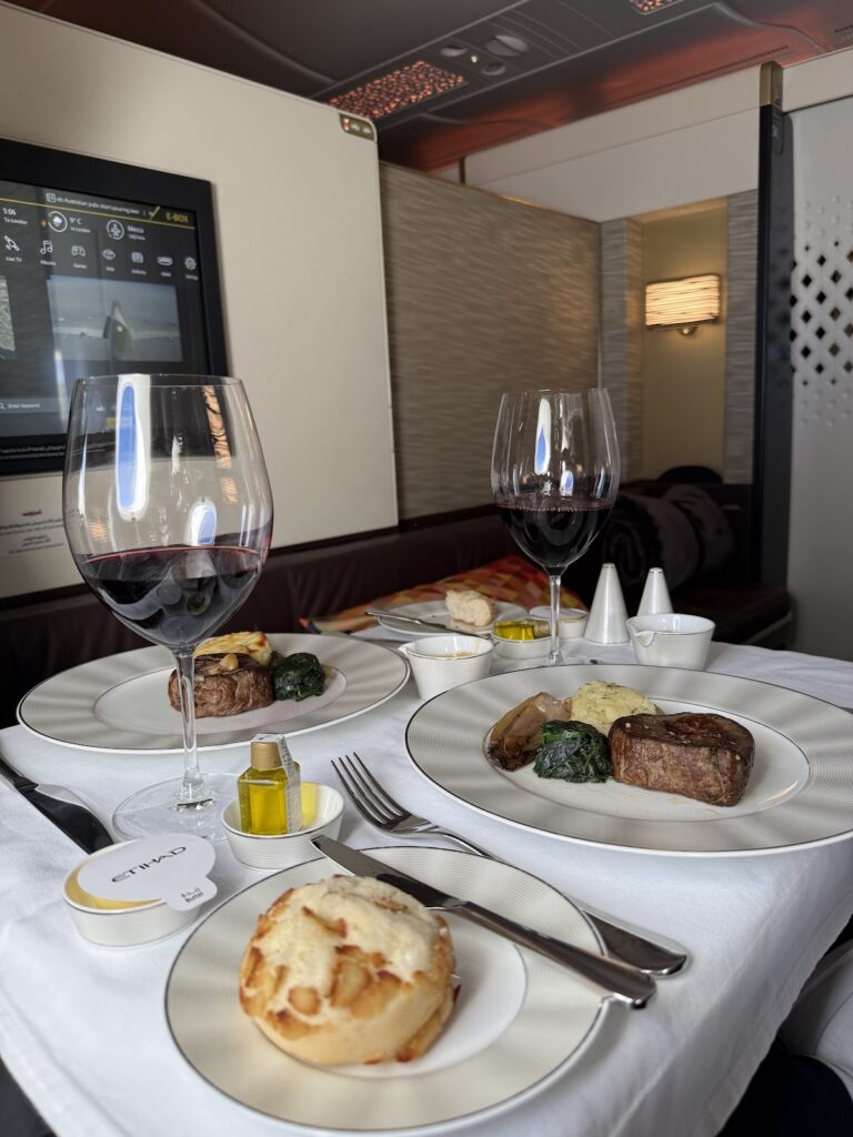 Beef fillet main course paired with red wine onboard