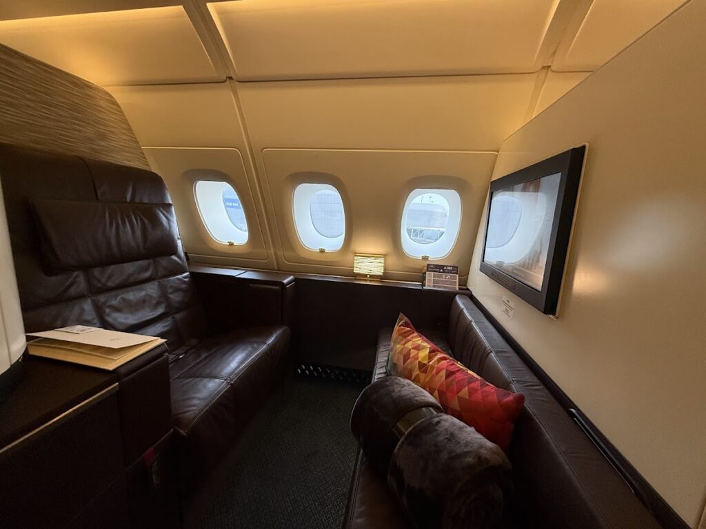 Etihad A380 Apartments seat with leather ottoman and windows