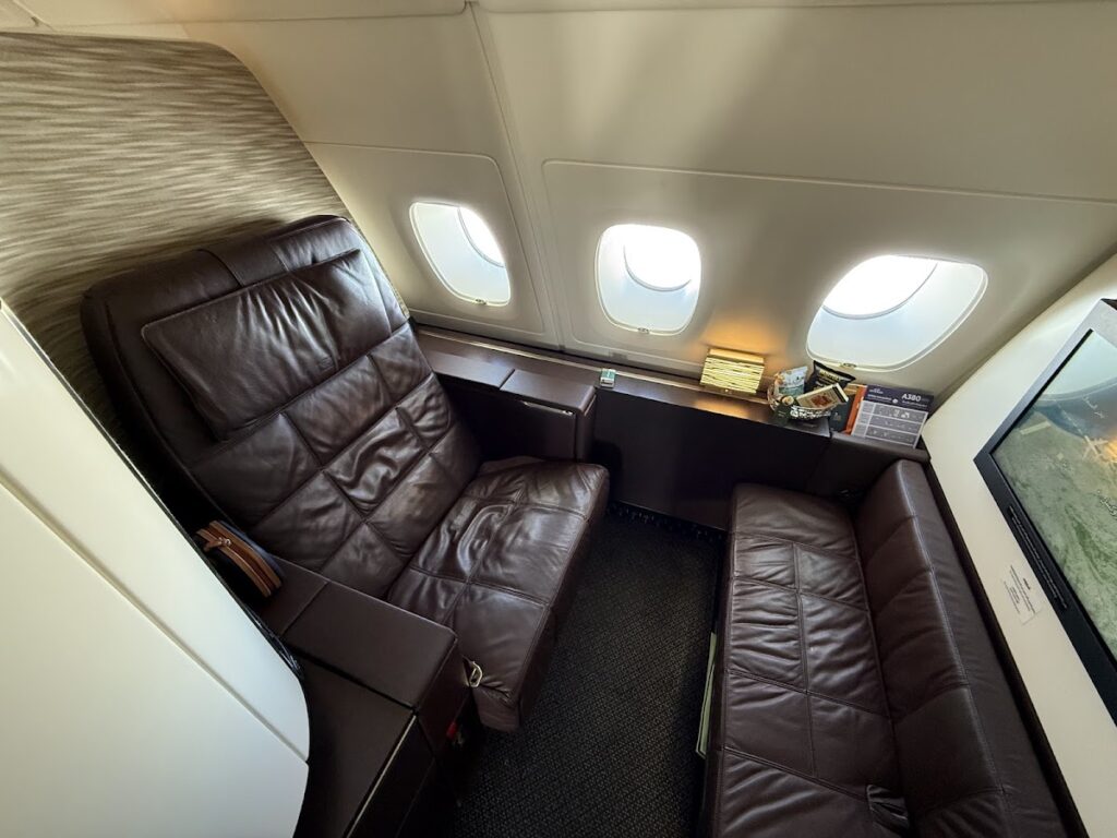 Etihad A380 Apartments suite with leather seat and ottoman