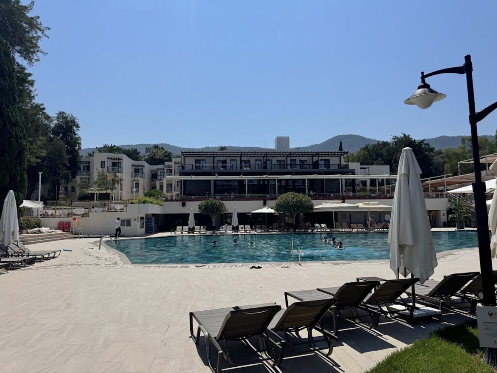Main pool area with loungers and resort building