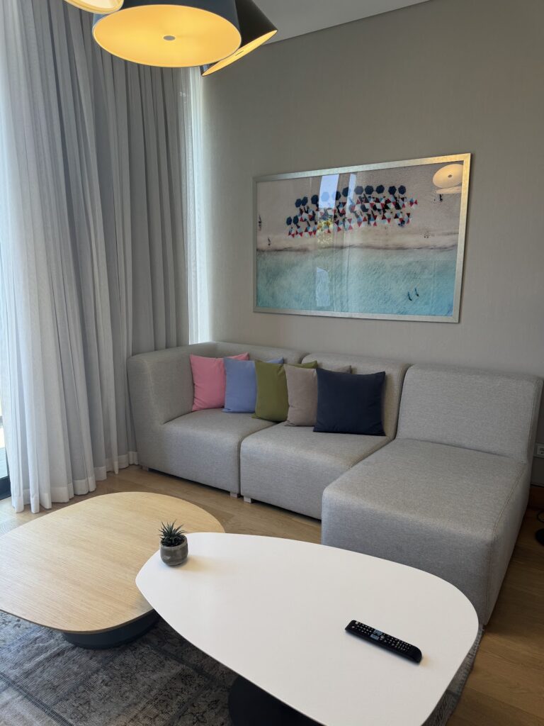 Suite lounge with aerial beach photograph artwork