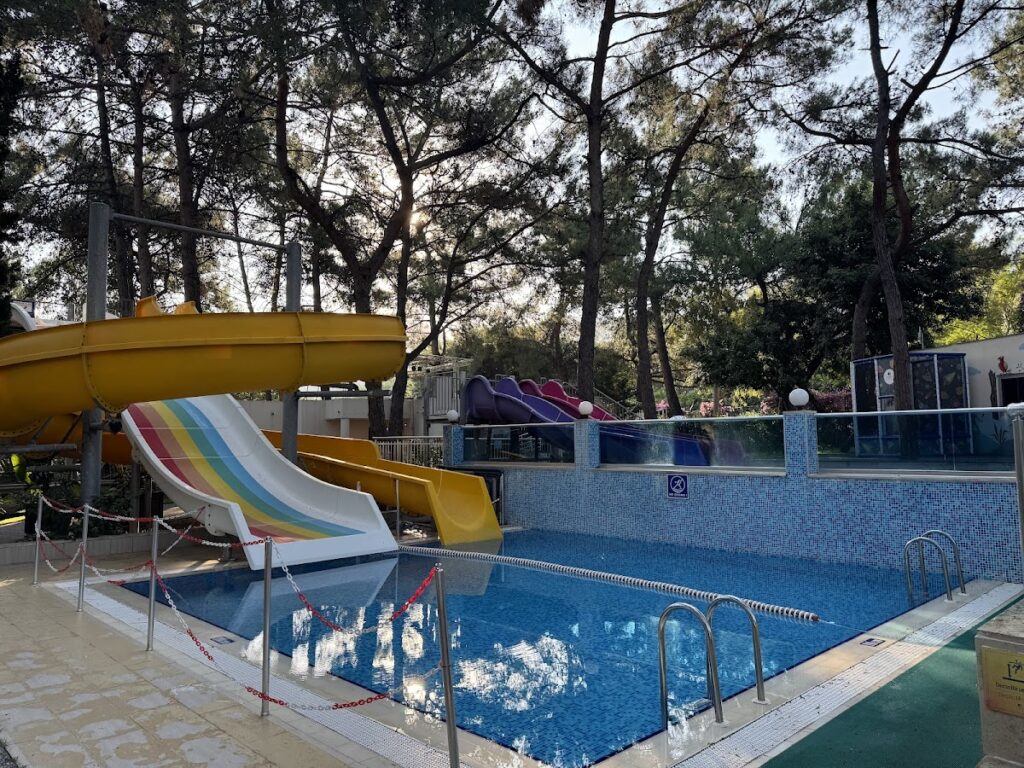 Resort pool with water slides and entertainment facilities