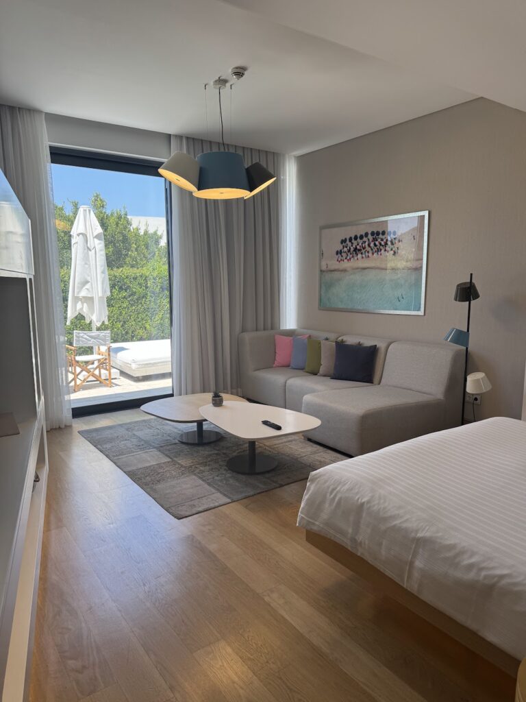 Suite interior with seating area and private balcony