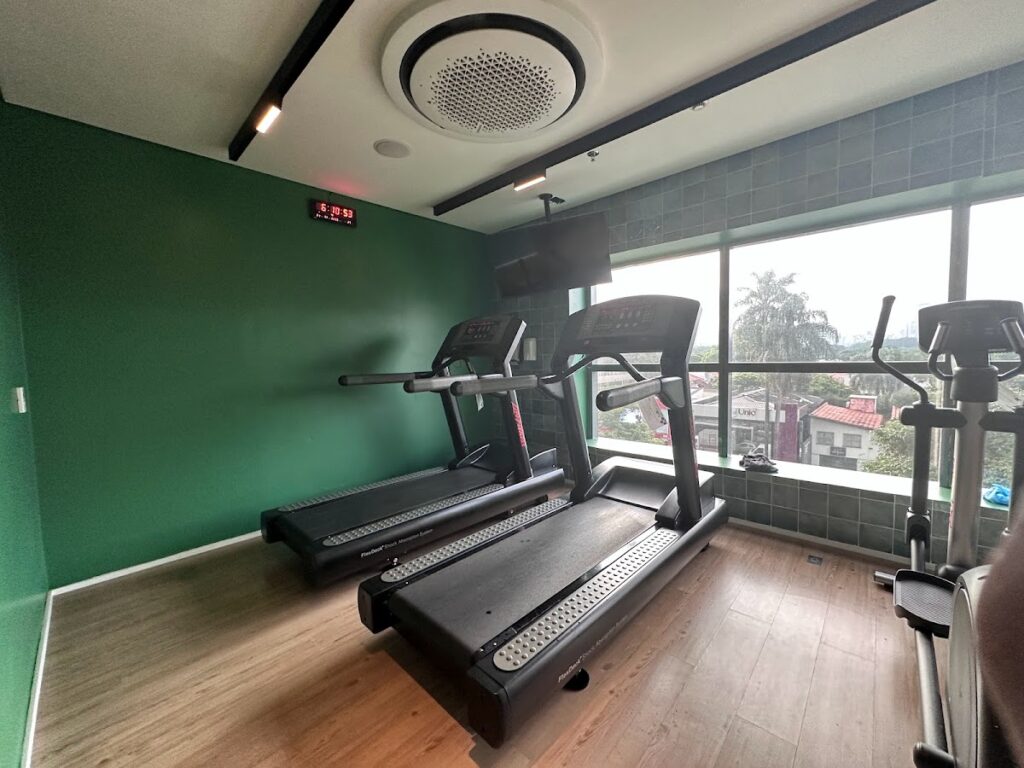 Fitness center with treadmills and city views