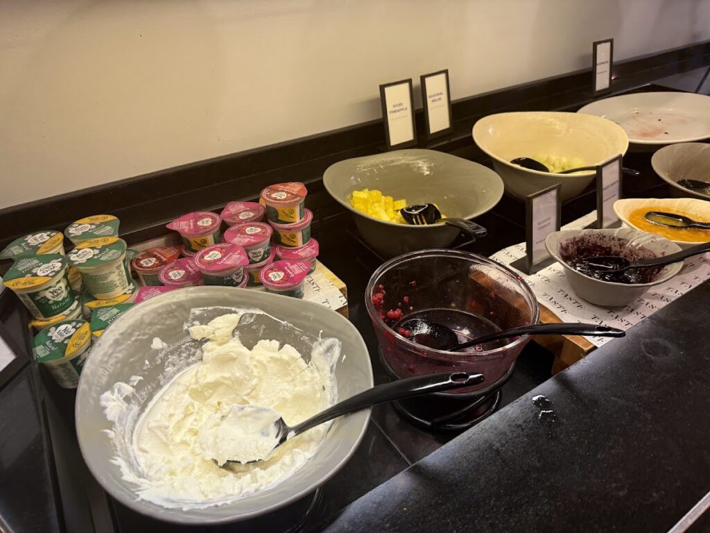 Executive lounge breakfast spread with pastries and jams