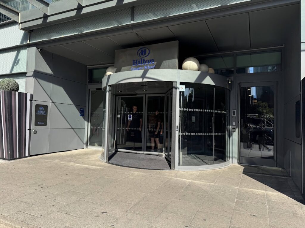 Hilton Canary Wharf exterior entrance with rotating doors