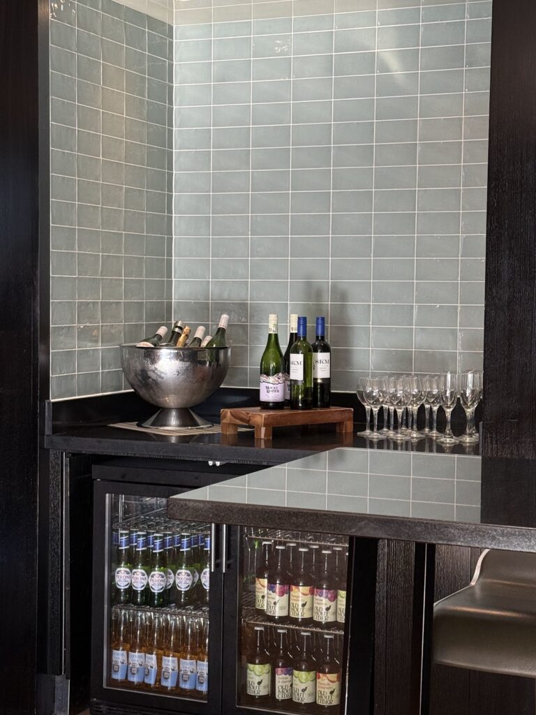 Executive lounge bar with wine display and cocktail glassware