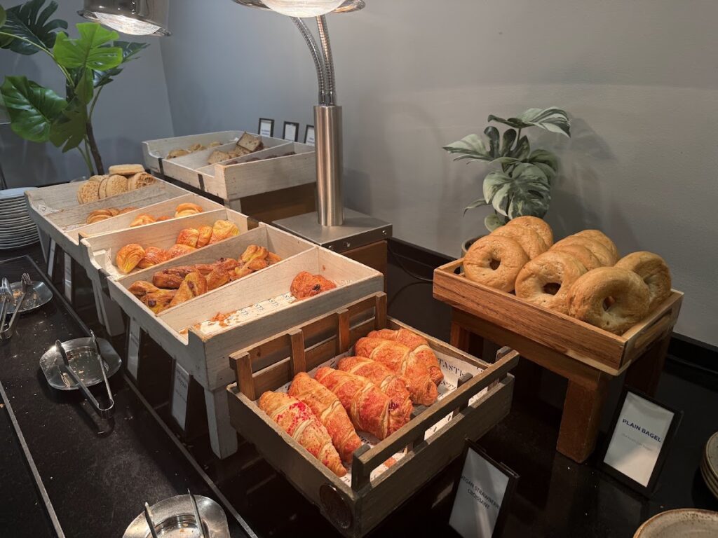 Breakfast pastries, donuts, and breads displayed buffet